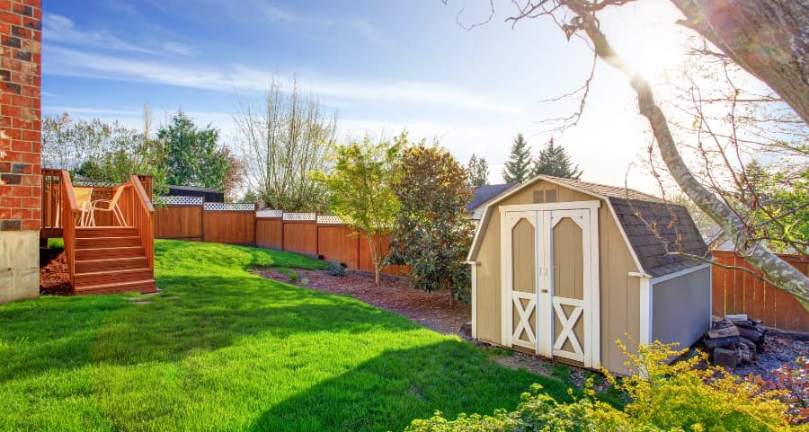 Fenced backyard with storage shed in Decatur